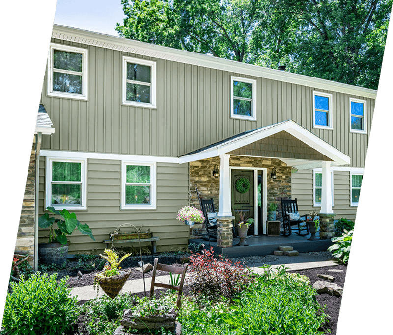 a nice home with cedar siding and a lot of windows